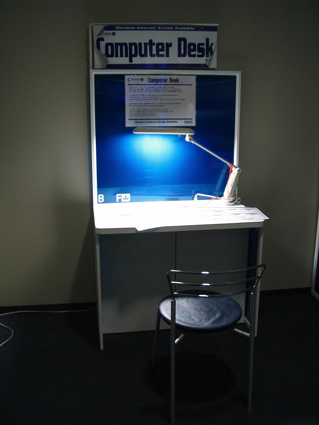 A computer desk with a chair